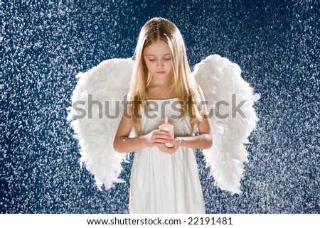 sad angel holding burning