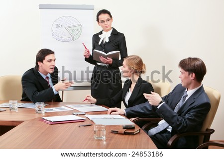Image of successful people sitting around table and sharing experience with elegant female listening to them attentively