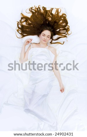 stock-photo-above-view-of-resting-female-under-linen-sheet-with-her-long-hair-spread-on-pillow-24902431.jpg