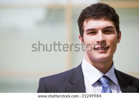 Face of modern businessman looking at camera