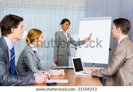 Photo of confident employer teaching business people how to manage organization