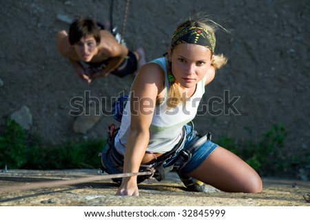 Woman and man engage in extreme sports