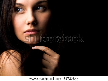 stock photo Image of gorgeous lady with dark hair touching it by hand and 