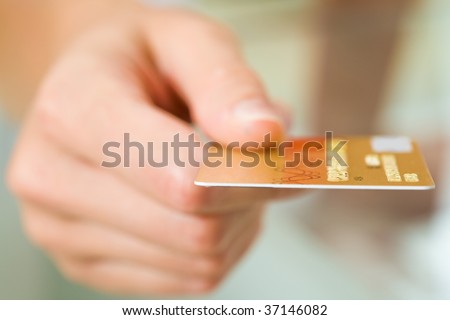 Macro image of plastic card in human hand