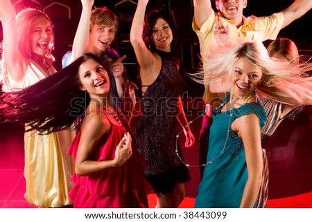 Portrait of energetic people clubbing at discotheque