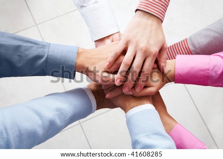 Close-up of business people?s hands on top of each other