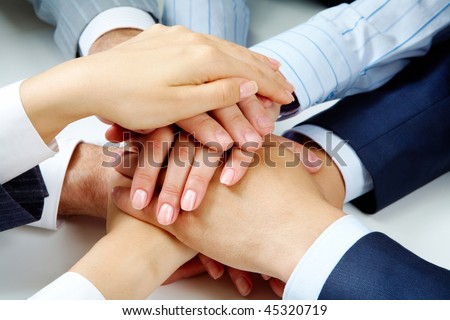 Close ?up of business people?s hands on top of each other