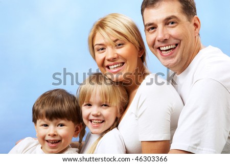 Portrait of joyful family laughing