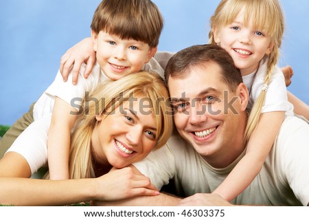 Photo of family members smiling at camera