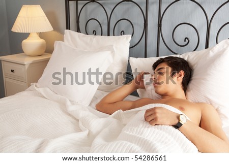 Image of young man having rest at night