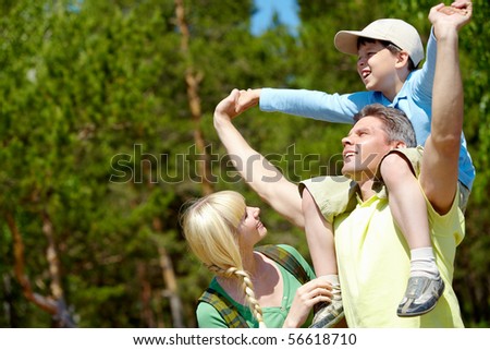 Portrait of happy family spending great time in the country