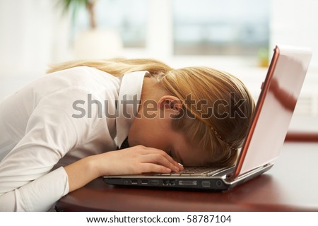 stock-photo-image-of-very-tired-businesswoman-or-student-with-her-face-on-keyboard-of-laptop-58787104.jpg