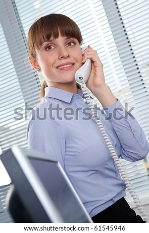 Photo of smart businesswoman calling somebody in office