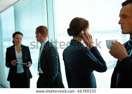 Four business partners interacting in office