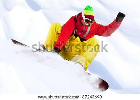 Image of snowboarder with holding his board during skating down