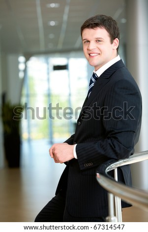 Portrait of attractive male in suit looking at camera