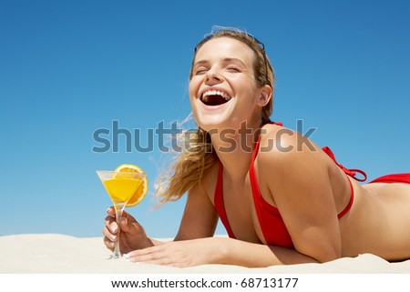 Portrait of charming woman screaming and holding cocktail