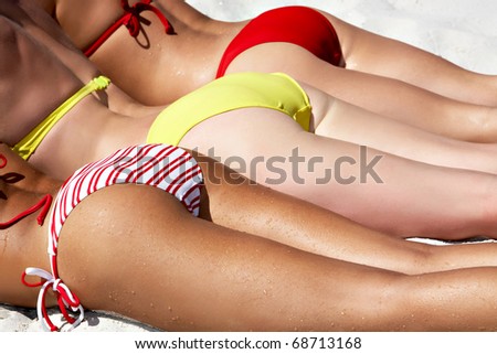 Image of line of feminine bottoms under the sun