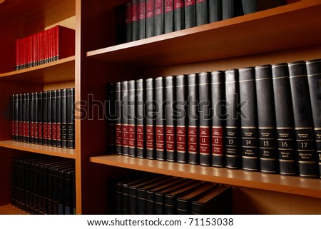 Photo of shelves with books in big library of educational institution