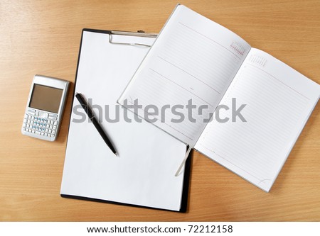 http://image.shutterstock.com/display_pic_with_logo/91282/91282,1298984722,6/stock-photo-image-of-workplace-with-paper-notepad-pen-and-palmtop-gadget-on-it-72212158.jpg