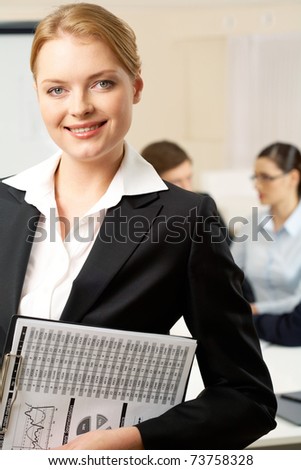 Portrait of with smart employer looking at camera in working environment
