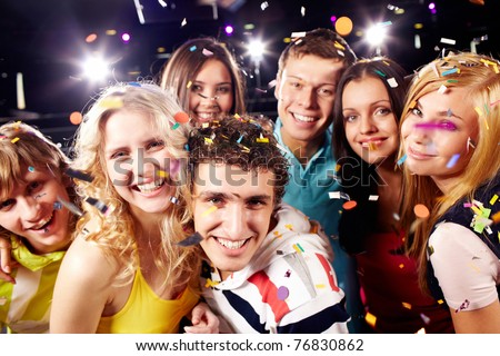 Portrait of happy glamorous friends in a night club