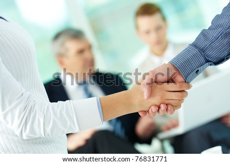 Photo of handshake of business partners after striking deal