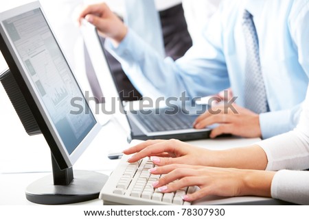 Image of female hands typing on keyboard in working environment