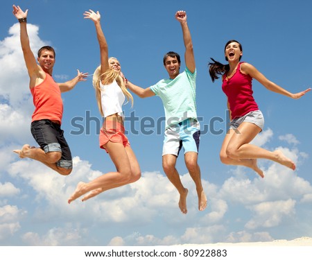 Portrait of four jumping happy people