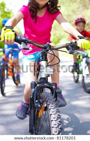 Close-up of children?s bike ridden by a girl