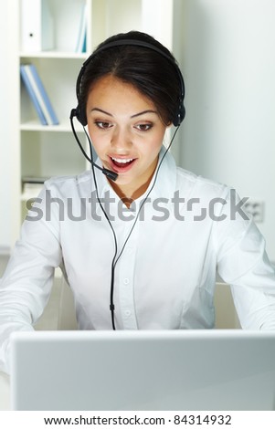 Photo of smart businesswoman with headset consulting client