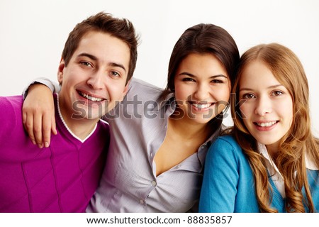 Portrait of attractive friends looking at camera and smiling