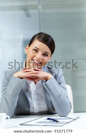 Image of young good-looking employer looking at camera
