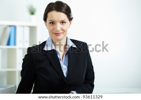 Portrait of happy office worker looking at camera