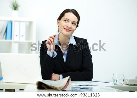 Portrait of happy office worker thinking of something