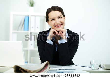 Portrait of happy office worker looking at camera