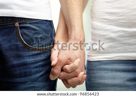Lovers holding hands showing their affection and supporting each other