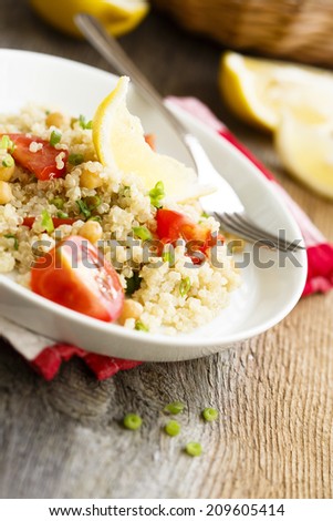 Warm quinoa salad with chickpeas and tomatoes