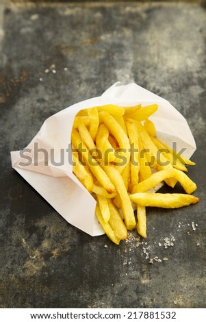 French fries in white paper bag