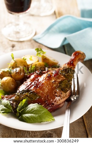 Baked duck leg with potatoes