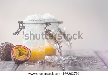 Jars full of ice and passion fruit juice on a hot summer day