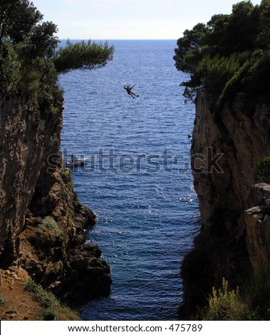 person falling between two cliffs