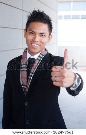 portrait of a young happy asian businessman