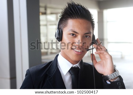 portrait of a young happy asian businessman