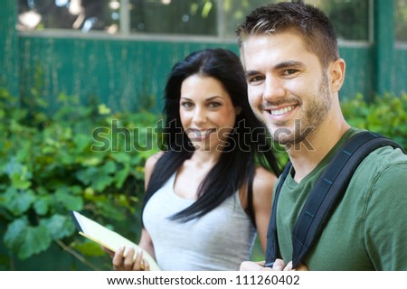 portrait of two college students on campus