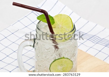 glass of lemon soda with lime
