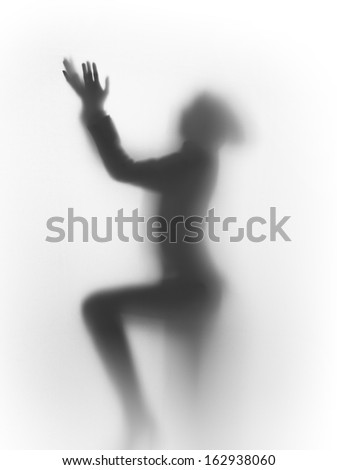 diffuse silhouette of a praying human
