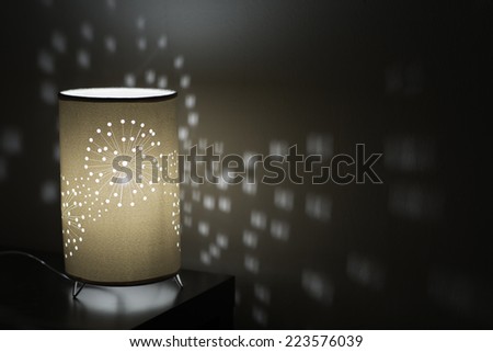 Table lamp on bedside cabinet