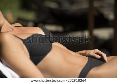 Sunbathing sexy woman body parts, outdoor
