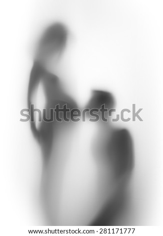 Pregnant woman and man together, silhouette